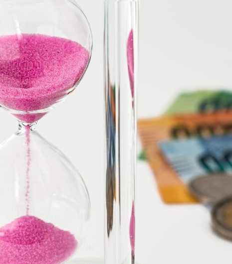 hourglass with some money